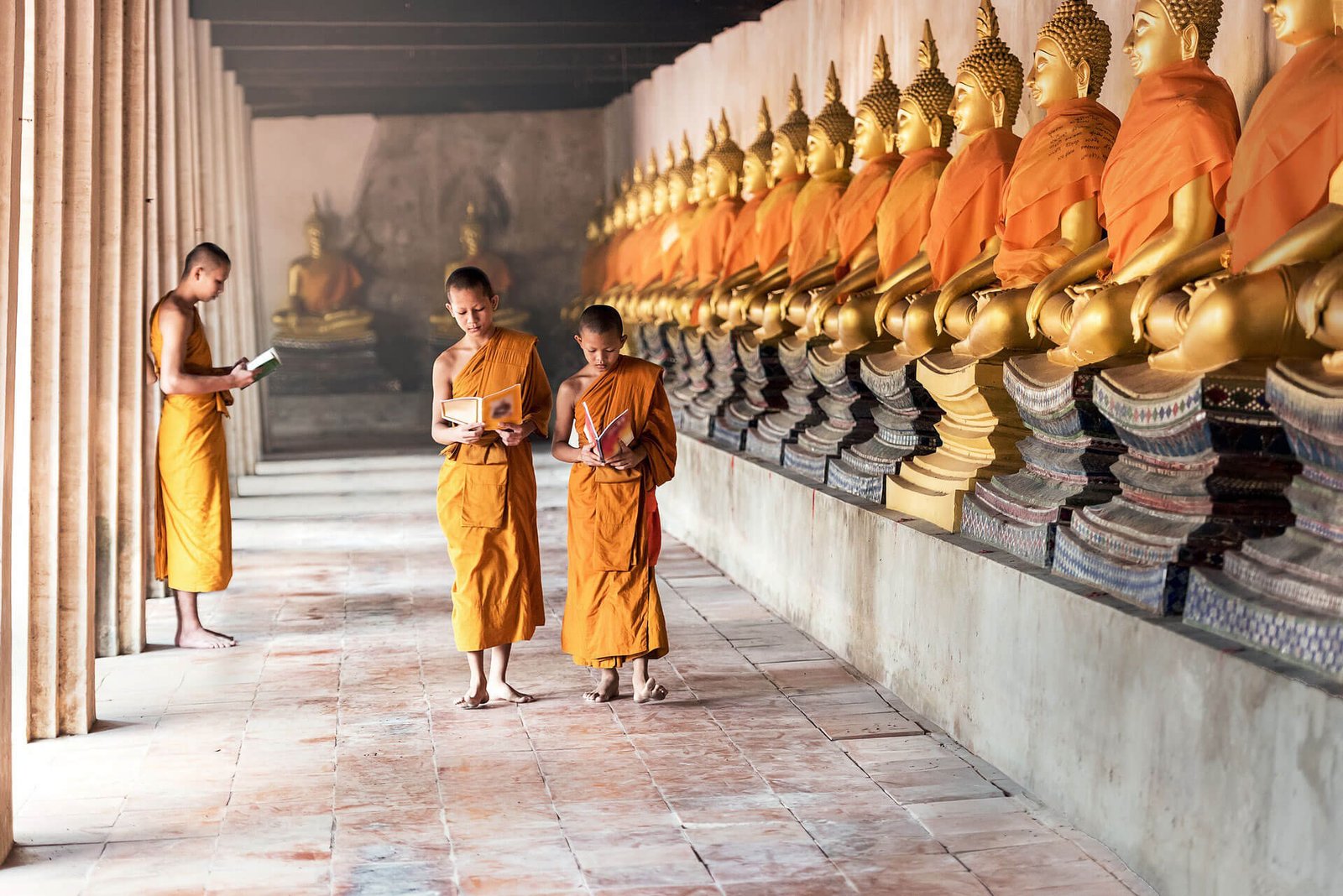 Buddhist Monks walking in corridor