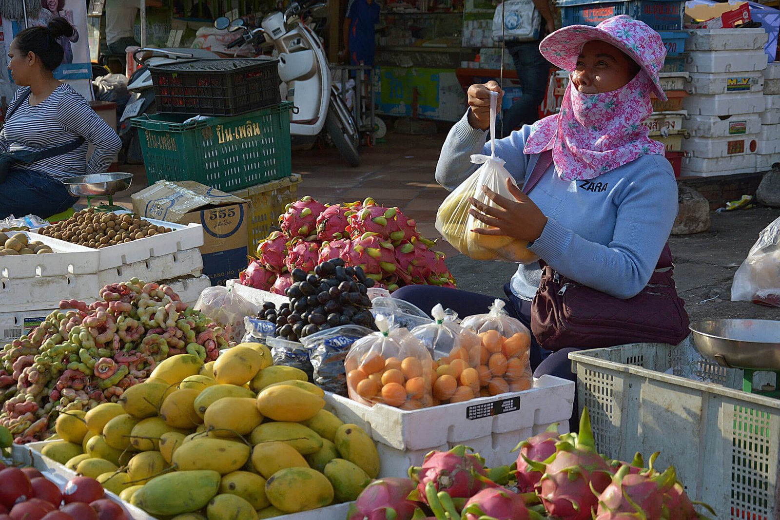 Cambodian street food vendor selling fruits